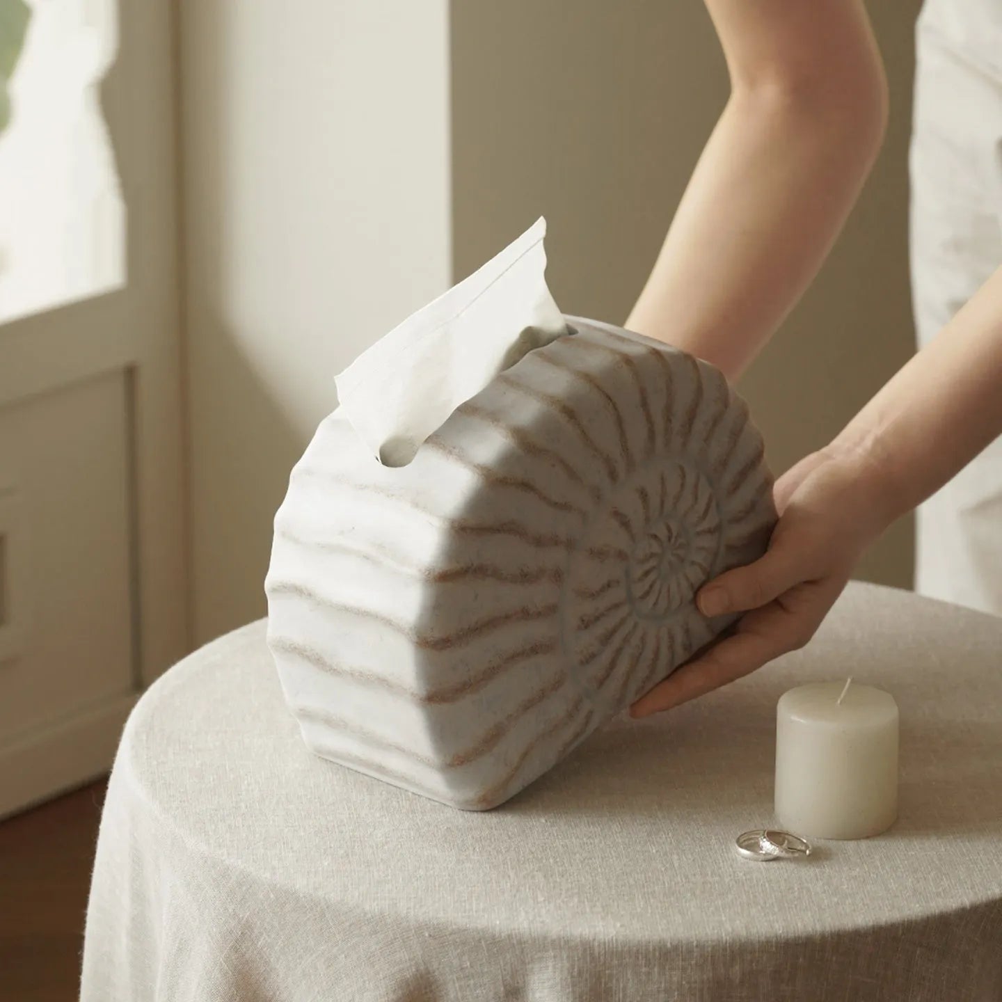 Modern minimalist resin tissue box holder in a conch ramble colour and pattern.