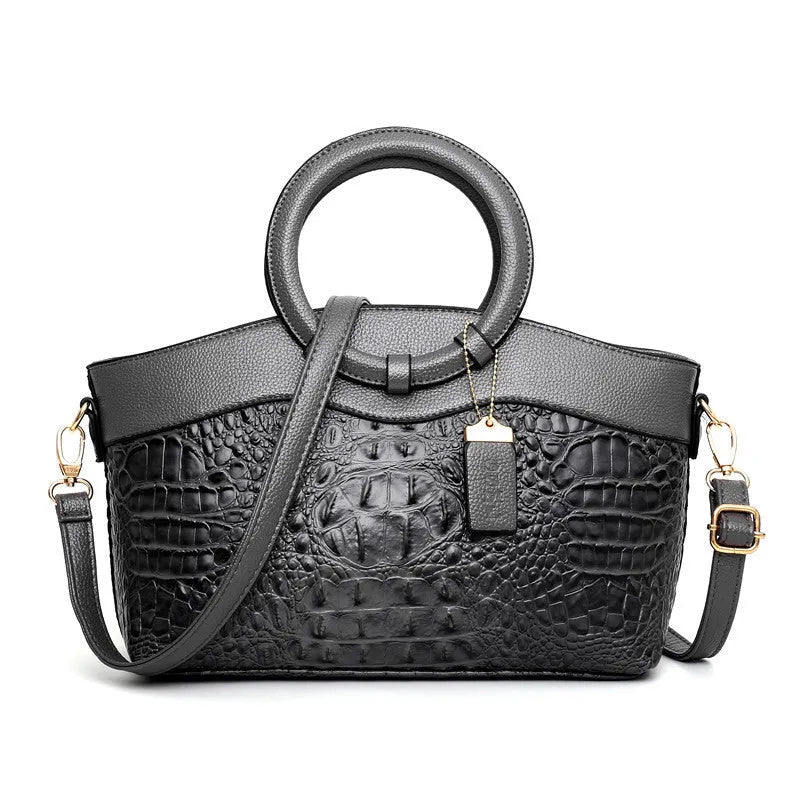 Fashion handbag in fabric with shoulder strap, showing internal phone and card compartments