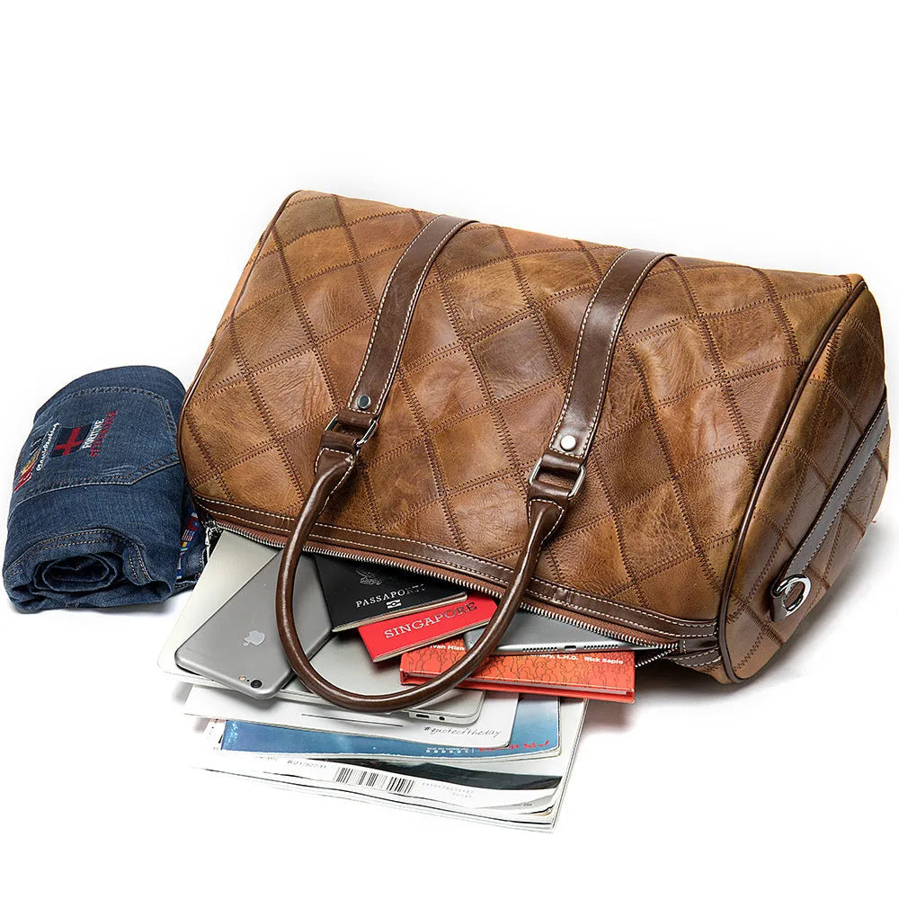 Men's vintage cowhide leather duffel bag with single strap, shown with internal phone and ID pockets.