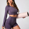 Women's black high-waisted yoga suit set with long sleeves, showing front and back view.
