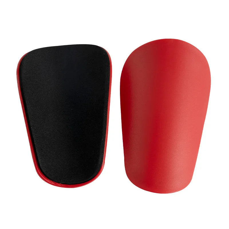 PU mini shin guards for football and sports protection in black, white, red and blue colours