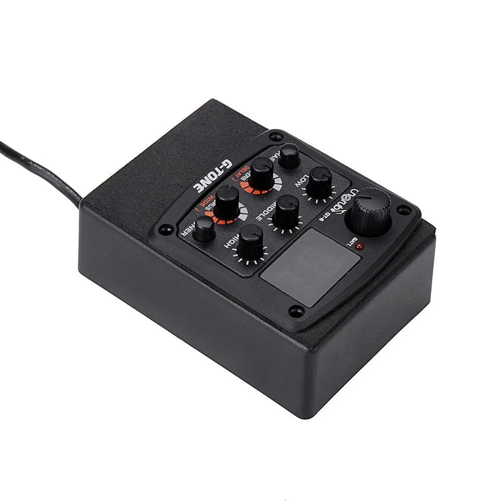 Black Cherub GT-6 acoustic guitar soundhole pickup unit with EQ and effects knobs.