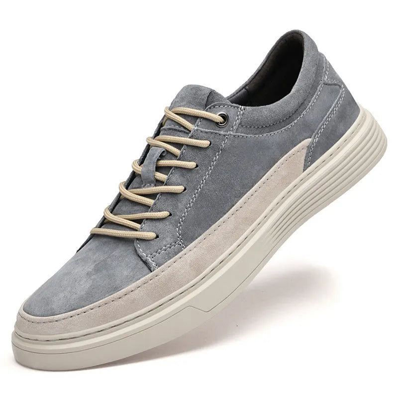 Men's grey and sand coloured low-top casual skate shoes with round toe and lace-up front.