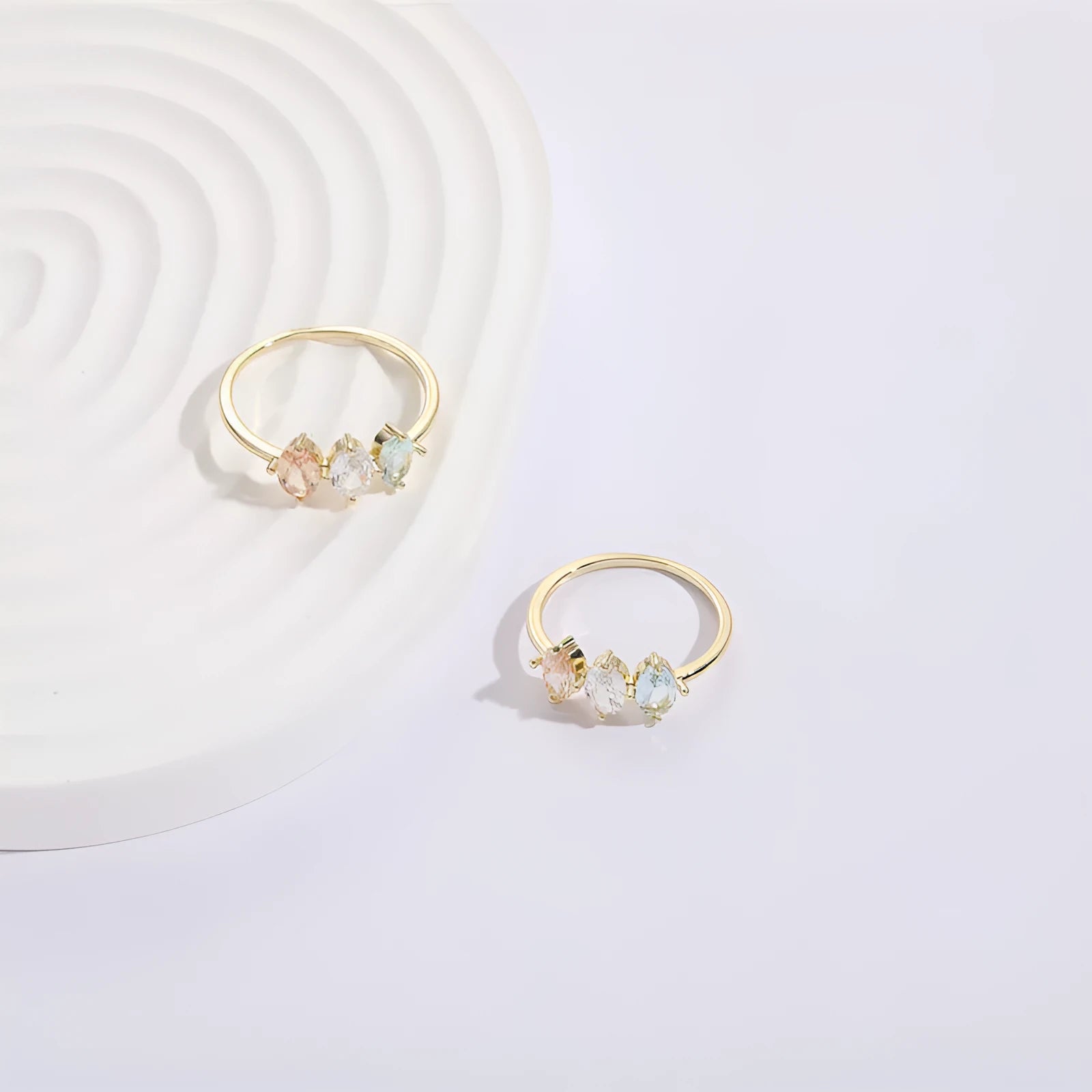 Gold electroplated geometric women's ring with triangular elements and horse eye tricolor zircon birthstone