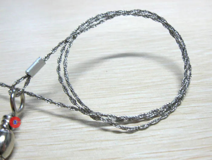 Stainless steel survival wire saw with thumb rings, total length 70cm for outdoor cutting tasks.