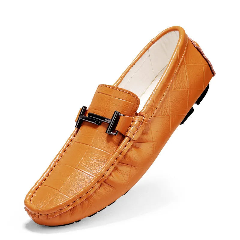 Men's brown leather casual loafers with a silver buckle on the front, shown from a side angle.