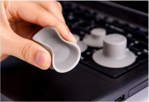 Grey durable plastic laptop cooling pad stand showing large and small non-slip pads.