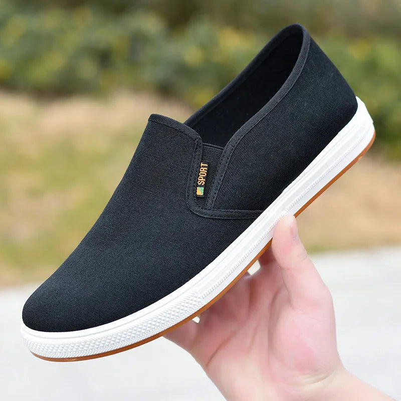 Men's black slip-on canvas shoes with round toe and composite sole