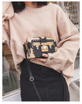 Women's hard PU leather shoulder bag with crossbody strap and flap design