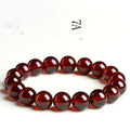 Natural orange red garnet crystal ball bracelet with Ruyi symbols in retro unisex design