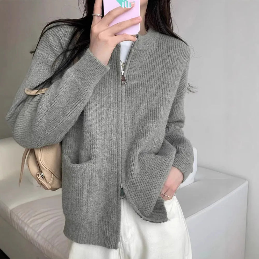 Beige viscose women's sweater coat cardigan with long sleeves laid flat.
