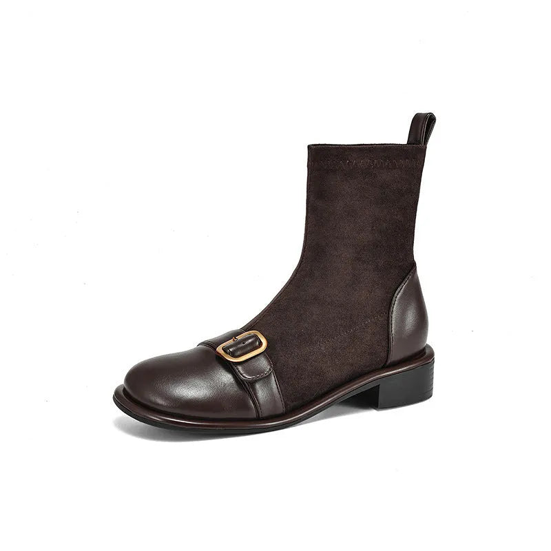 Women's black low-heel Martin ankle boots with front lace-up and belt buckle detail stitching.