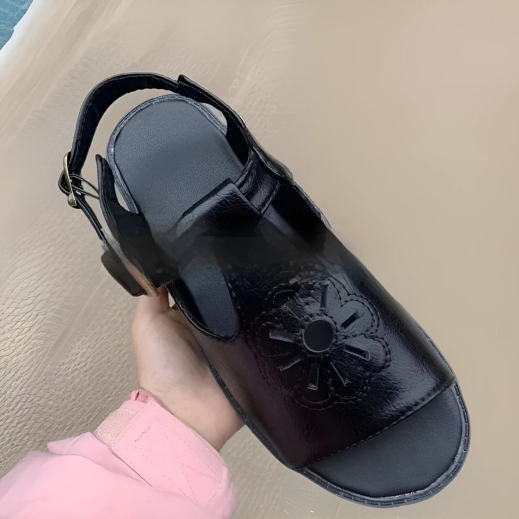 Men's black embroidered beach sandals with flower pattern showing flat heel and PU upper material