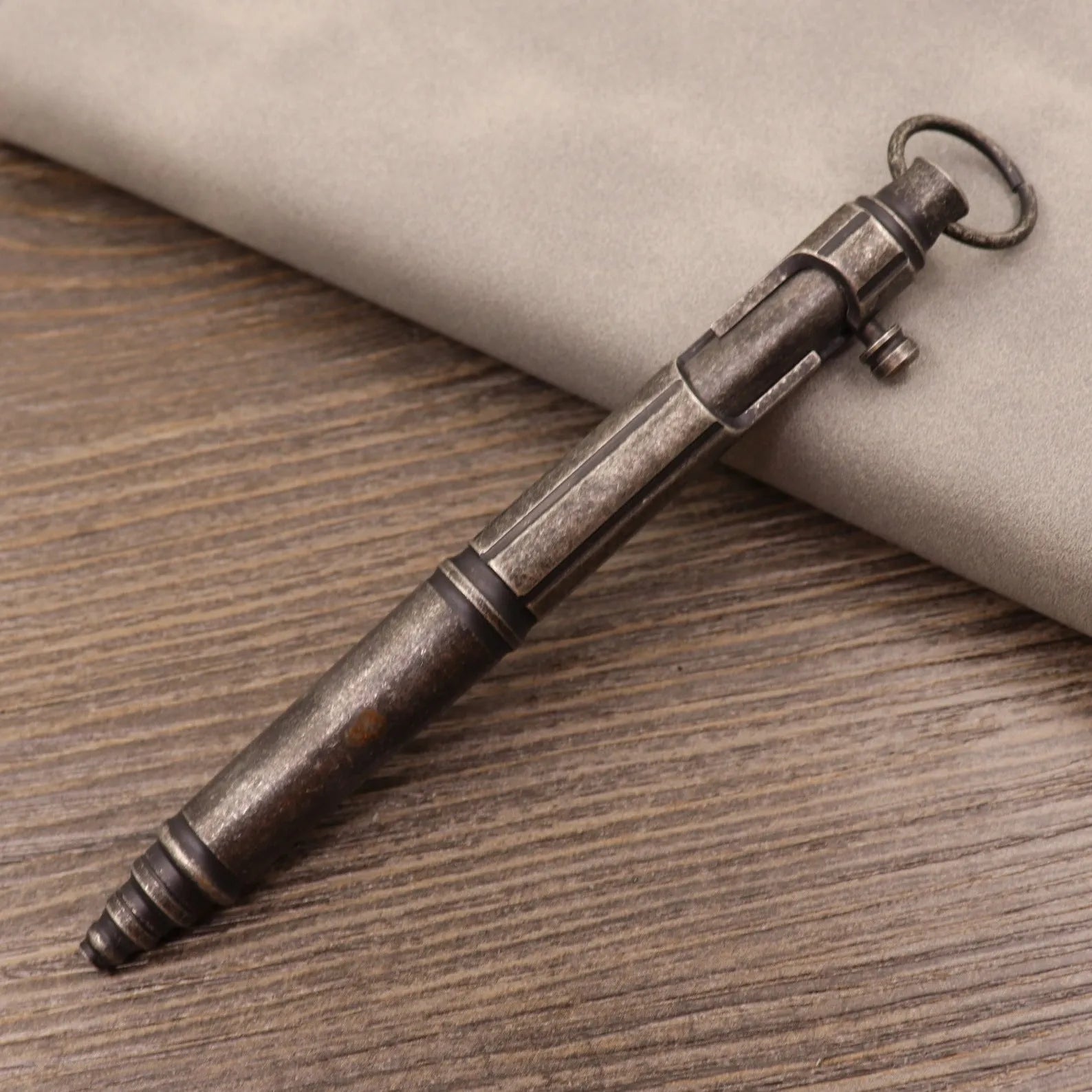 Brass tactical pen with bolt-action mechanism and retro brushed finish