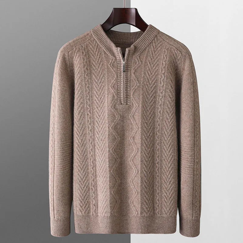 Man wearing a milky white half-zip wool sweater with a diamond pattern, showing loose fit and long sleeves.
