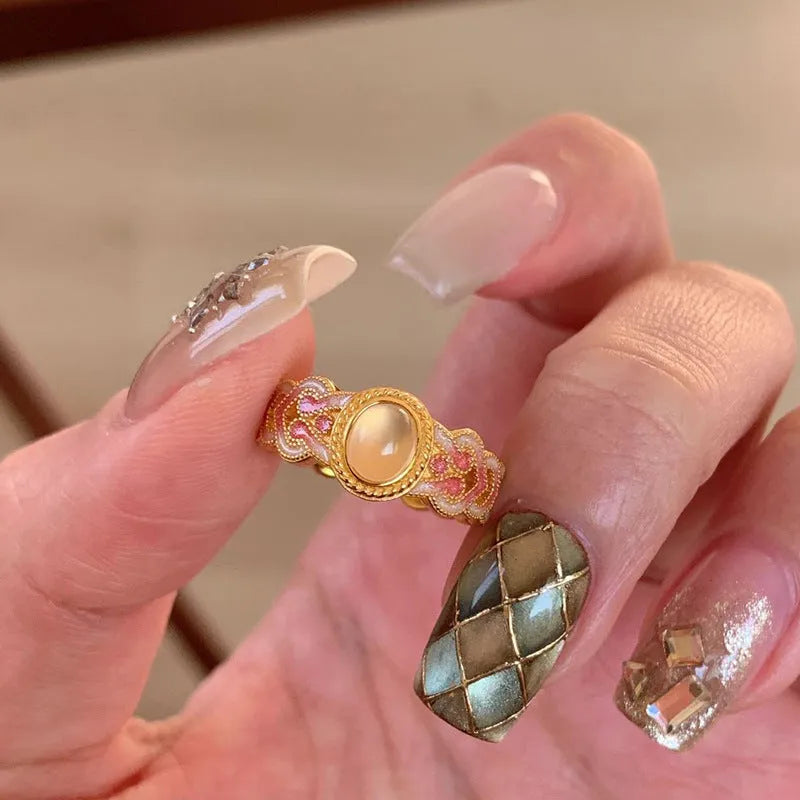 Women's pink crystal enamel ring with open mouth adjustable design and geometric shape.