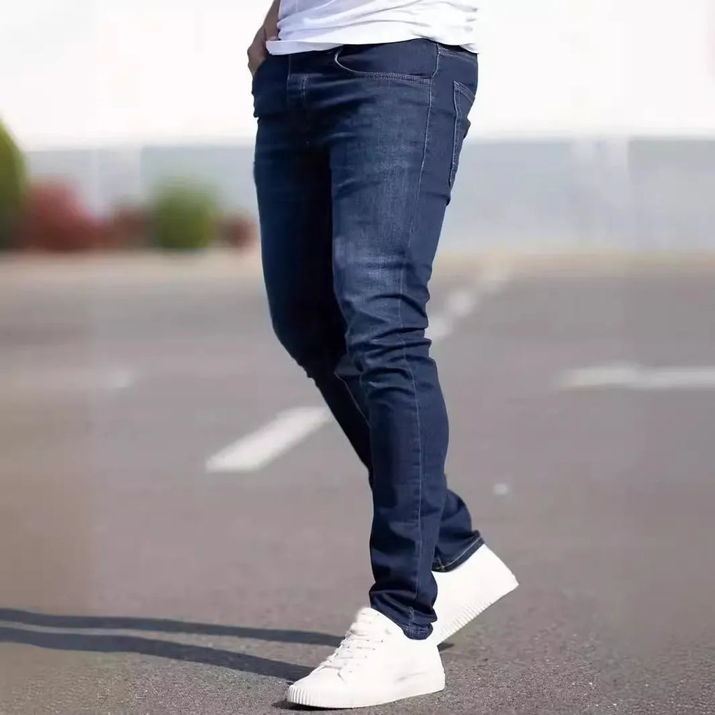 Men's dark blue slim fit jeans with skinny leg design and mid waist cut