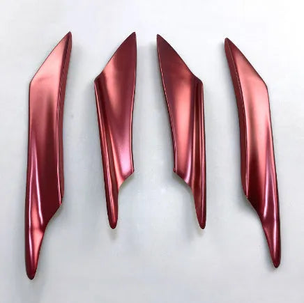 Set of four carbon fibre effect ABS plastic bumper air knife spoilers for car styling.