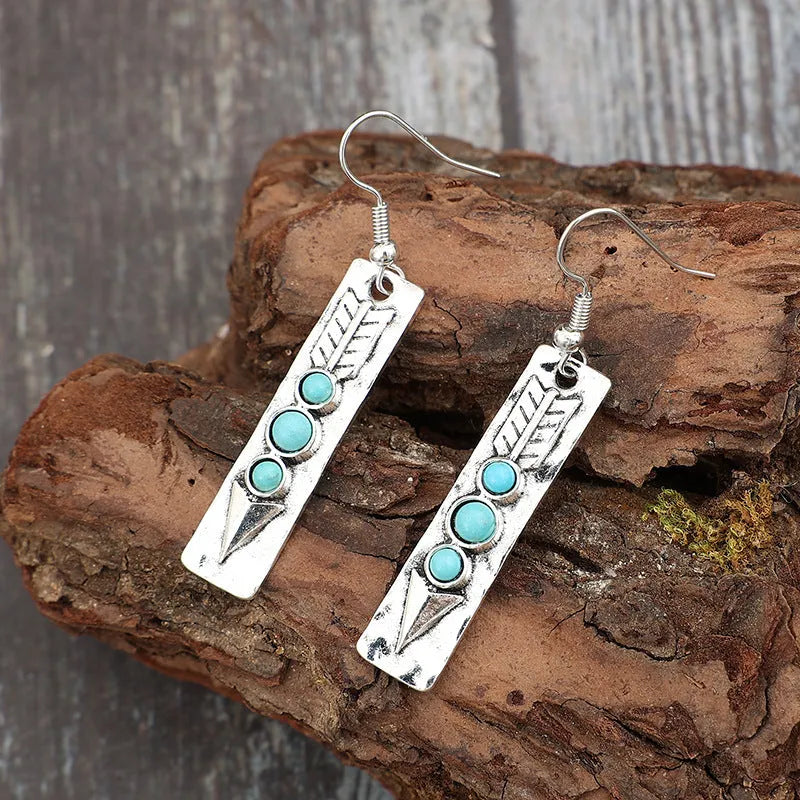 Silver geometric earrings with long strip design and turquoise inlay details