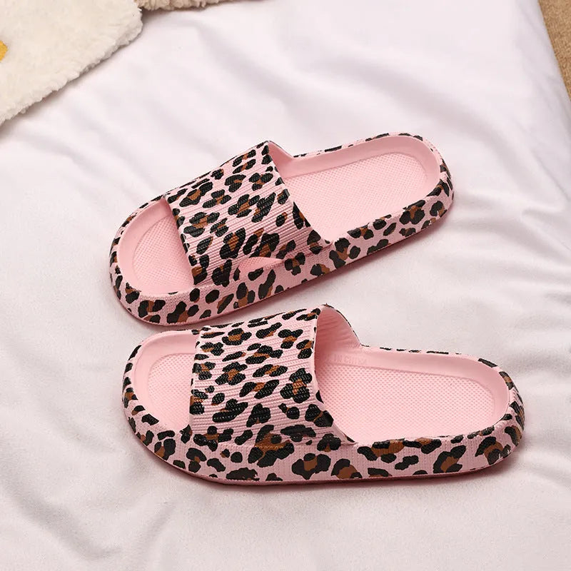 Women's leopard print slipper with thick EVA sole shown in multiple colour and print options.