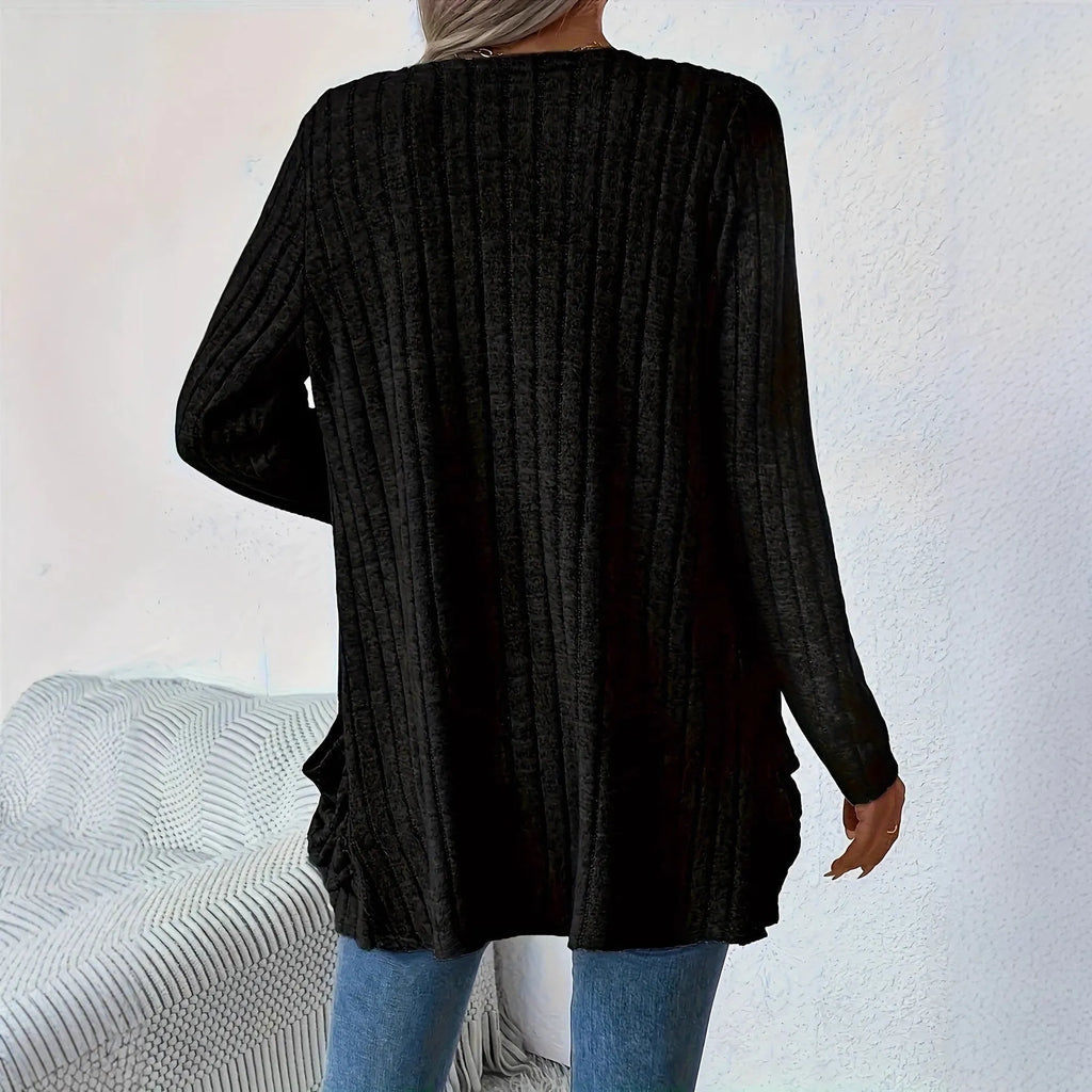 Grandma Grey loose fit long sleeve cardigan with two front pockets, shown on a hanger.