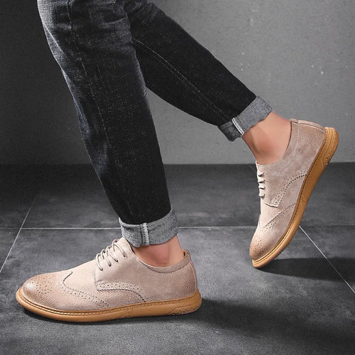 Men's black genuine cowhide business lace-up shoes with leather toe cap on a grey background.