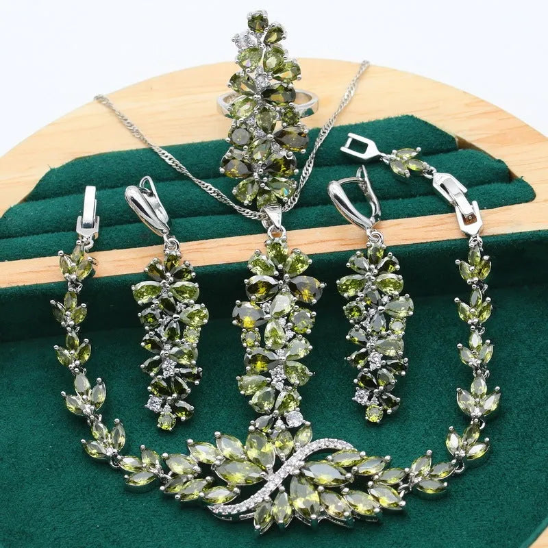 Complete retro floral jewellery set in copper with zircon stones, showing necklace, bracelet, earrings, and ring in olive green finish.