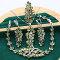 Complete retro floral jewellery set in copper with zircon stones, showing necklace, bracelet, earrings, and ring in olive green finish.