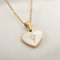Gold plated heart-shaped necklace with white shell pendant on adjustable stainless steel chain