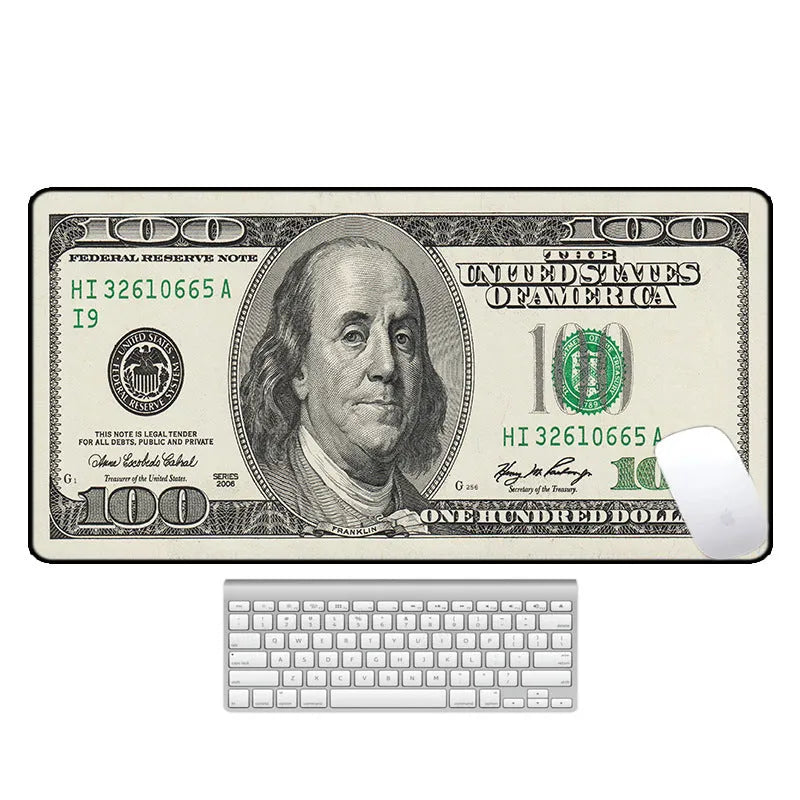 Large printed desk mat with natural rubber non-slip base on a wooden desk with keyboard and mouse.