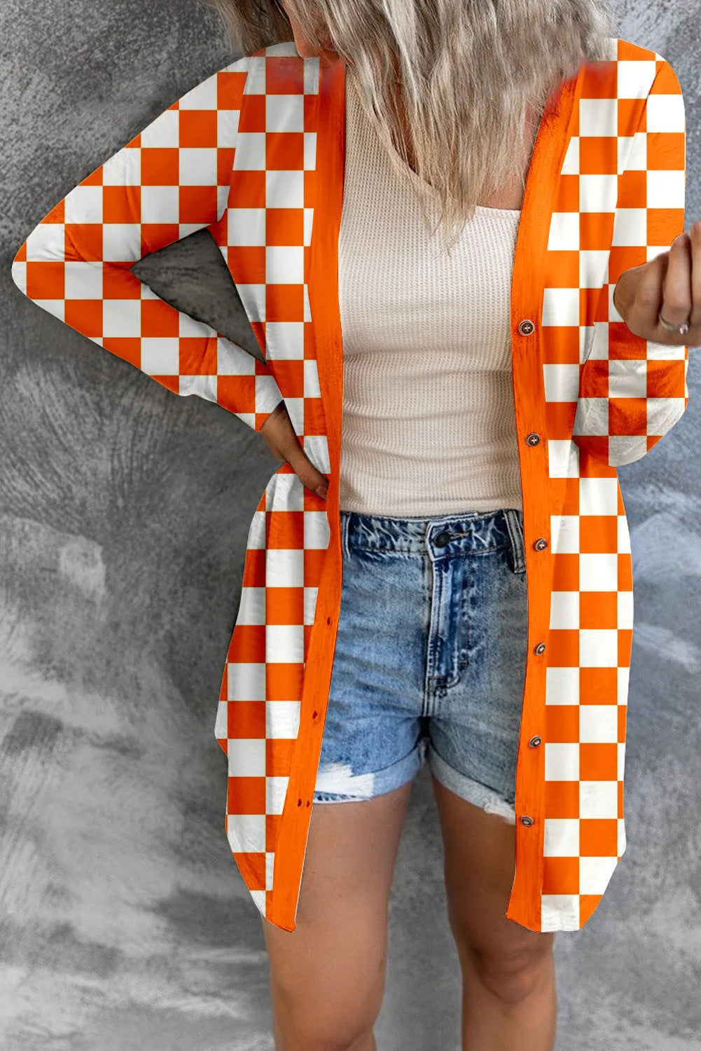 Women's long grey plaid knitted cardigan coat with regular sleeves on a hanger