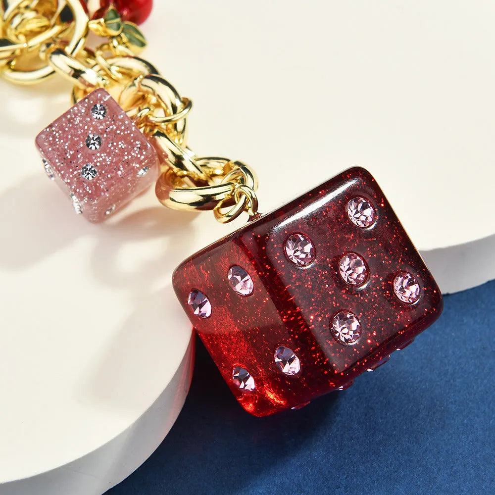 Cherry two-tone dice keychain pendant with square pattern metal design