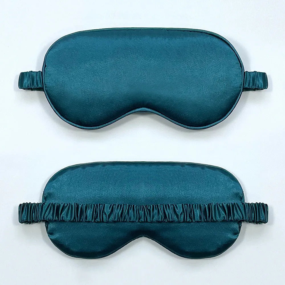 Double-sided Rayon elastic satin sleep mask shown in multiple colour options including sky blue, black, wine red, and light pink.