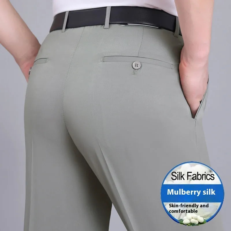 Men's straight-leg mulberry silk blend dress trousers in black on a hanger