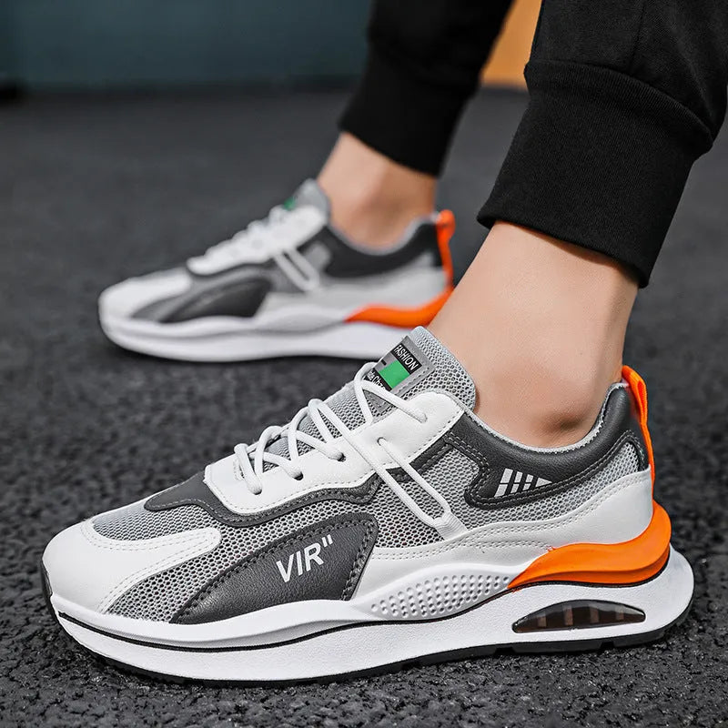 Men's gray and black mesh running shoes with a round toe and middle-top design on a white background.