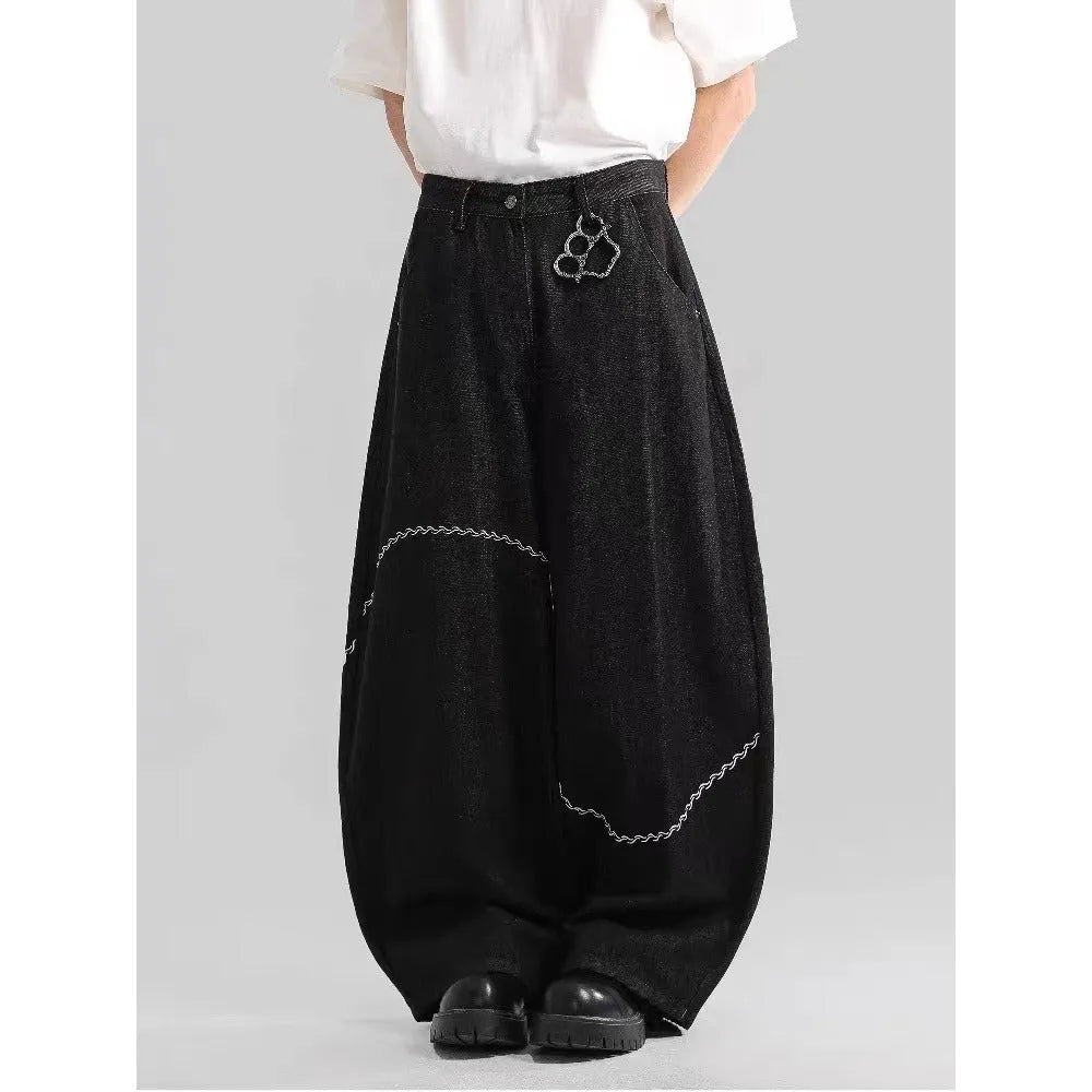Men's black straight-leg jeans with a mid waist and zip fly, shown laid flat.