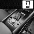 Unksera car interior decorative film sticker kit showing dashboard and centre console application with carbon fibre finish