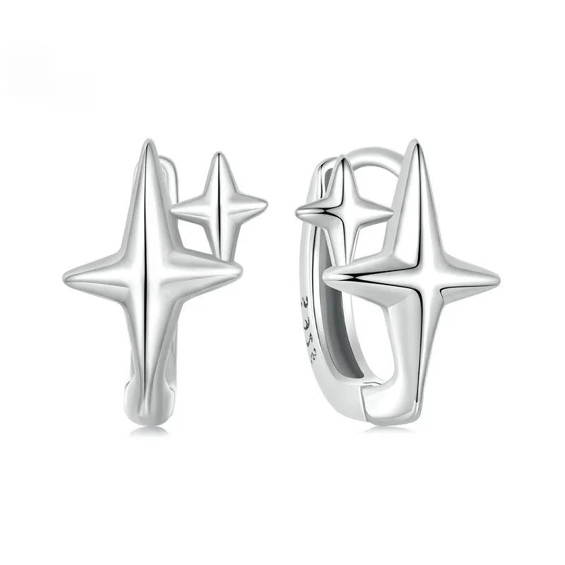 Minimalist star sterling silver ear clips with oxidised finish and XINGX element styling