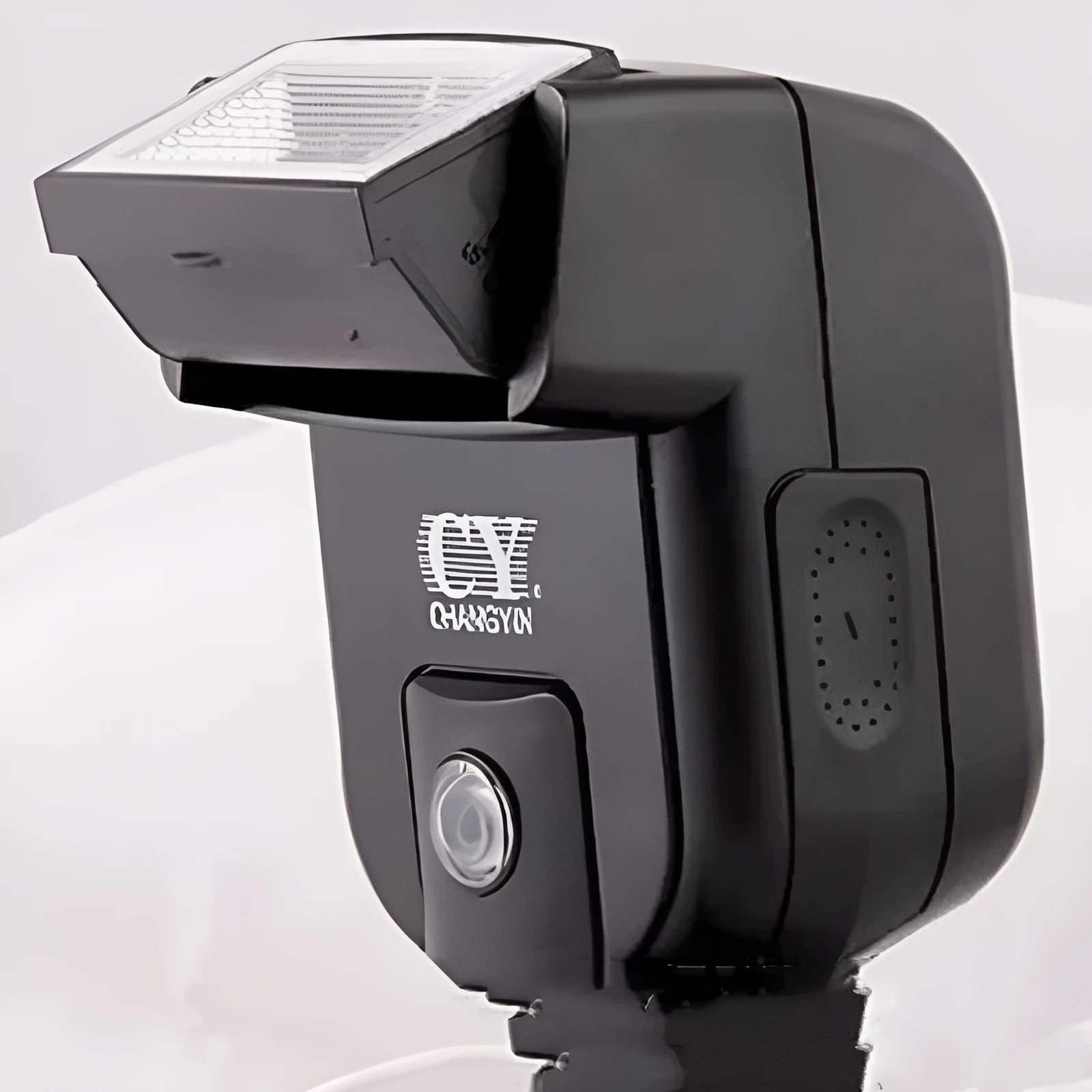 SLR camera hot shoe flash accessory with 90-degree tilt adjustment, shown with AA batteries for scale