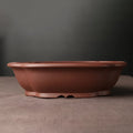 Handmade purple clay bonsai basin measuring 25x20x7 cm with classical Chinese design