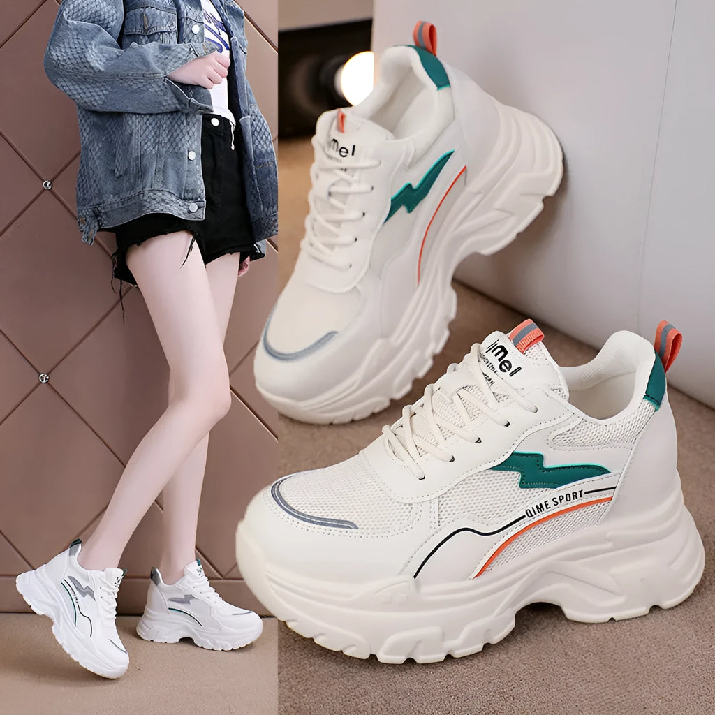 White women's dad shoes with cross shoulder straps, breathable mesh, and a rubber sole.