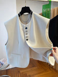 Beige loose-fitting waistcoat dress with bandage construction and pocket detailing