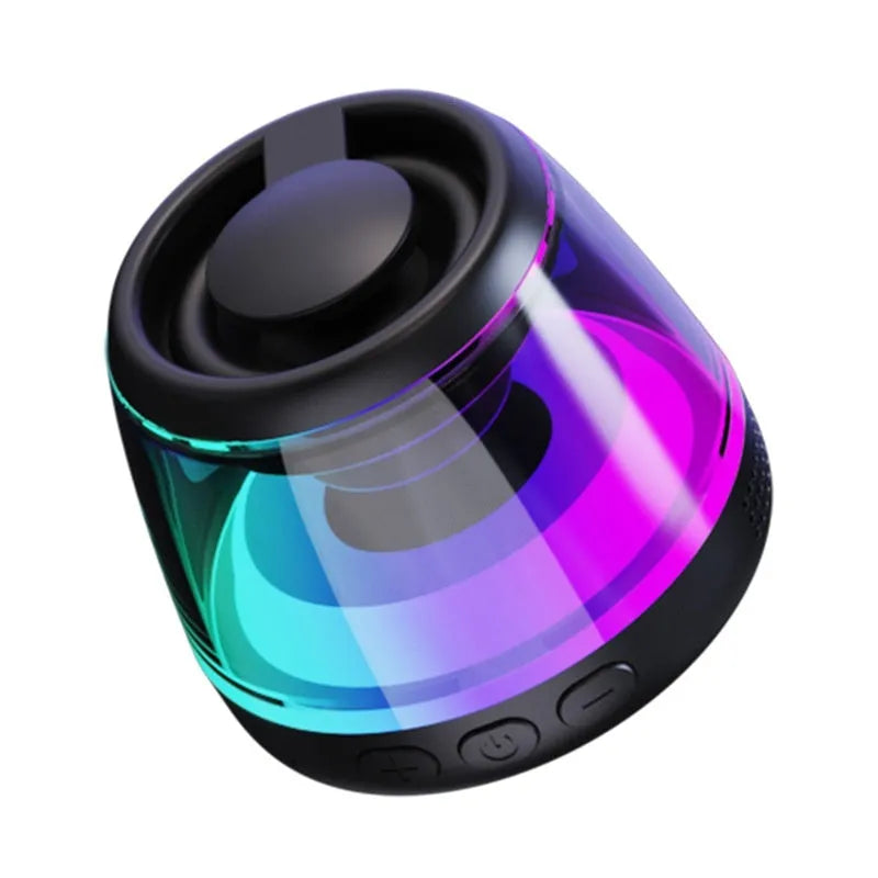 Small black or white portable Bluetooth speaker with a magnetic base and built-in lighting.