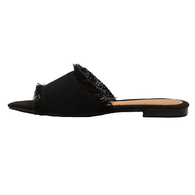 Women's denim flat slippers with tassel detail in multiple colour options showing leather lining and PVC sole