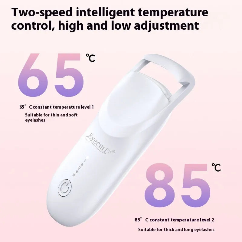 Electric heating eyelash curler in pink with USB charging cable on a white background