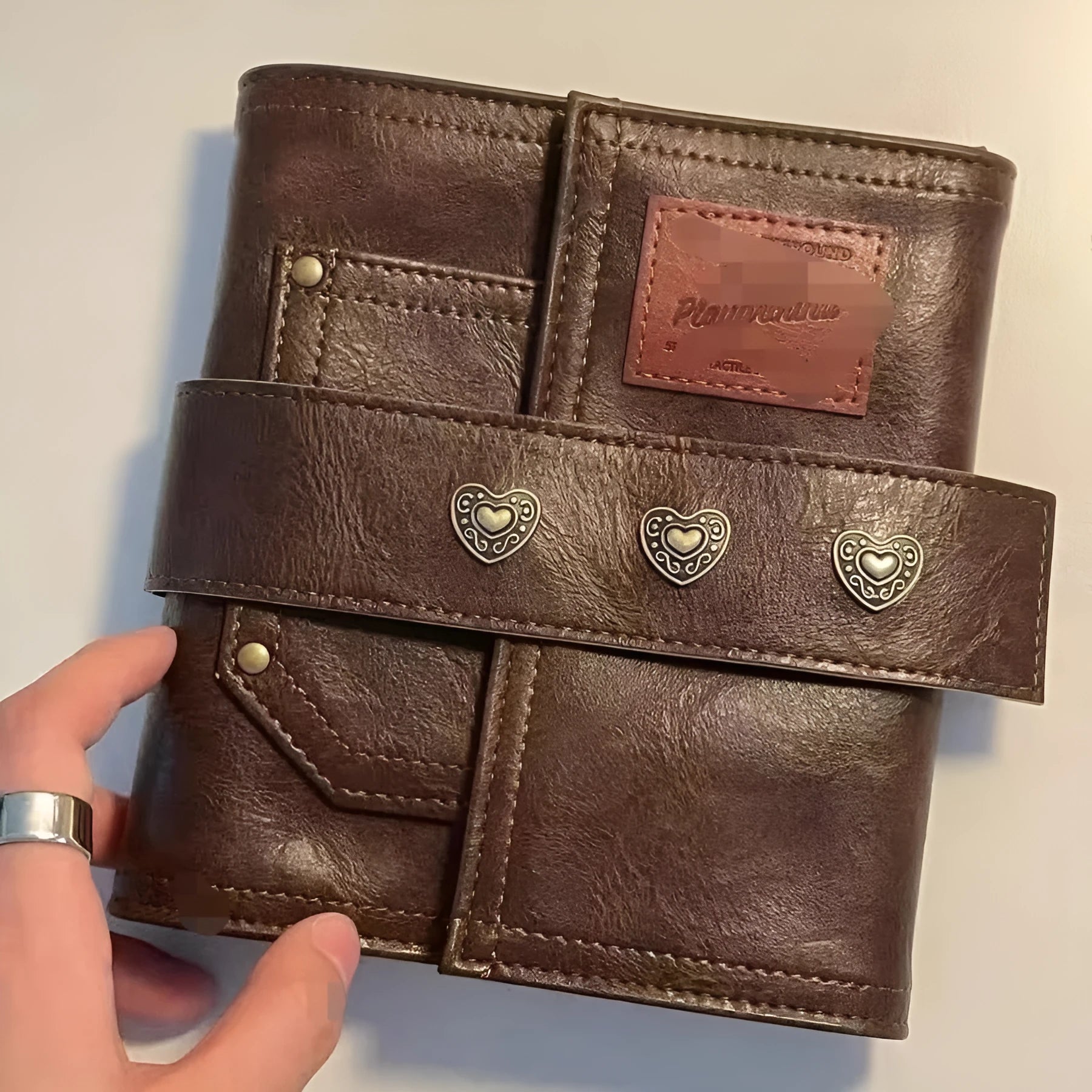 Brown retro leather buckle notebook with loose-leaf binder binding, A7 size with raw wood pulp paper