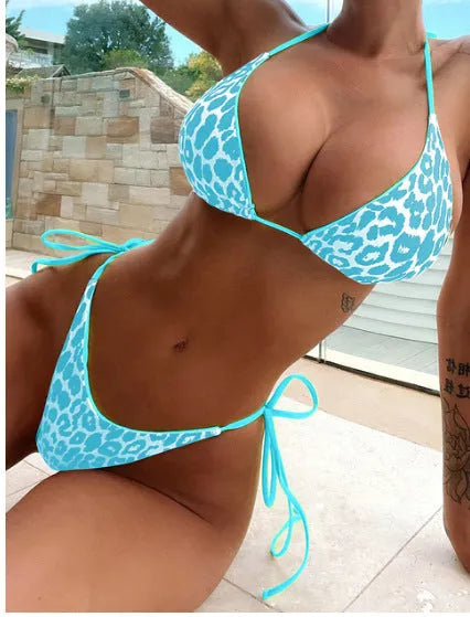 Women's lace-up front triangle bikini top with high-waisted split-leg swimsuit bottoms.