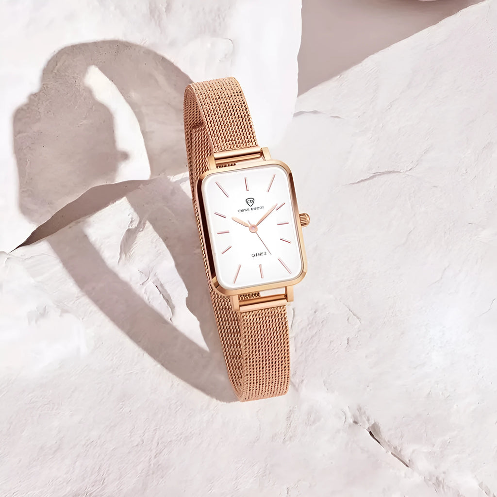 Women's waterproof quartz watch with woven steel strap in rose gold colour showing alloy case and mineral glass