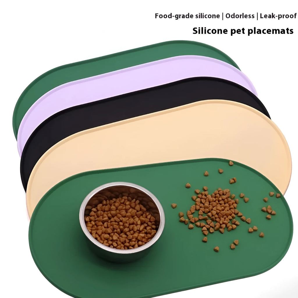 Silicone waterproof cat feeding placemat in beige colour on a wooden floor next to a pet bowl.