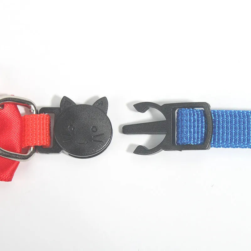 Adjustable nylon cat collar with decorative bow and bell in multiple colour options including red, blue, pink and green
